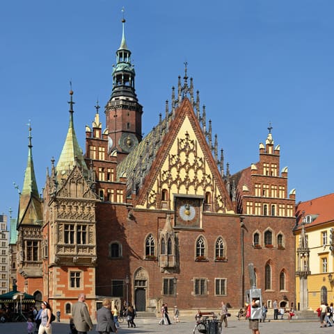 The ornate east gable and astronomical clock of Wrocław's old town hall.